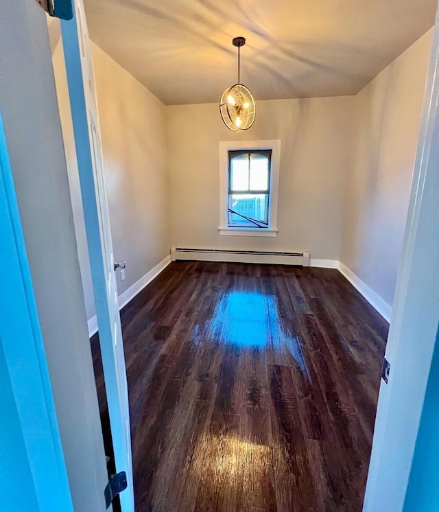312 S Pearl St, New London, WI 54961 - spare room with a baseboard radiator, baseboards, and wood finished floors