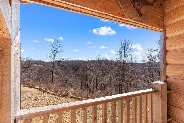 9614 Mississippi Ln, Bagley, WI 53801 - balcony featuring a wooded view