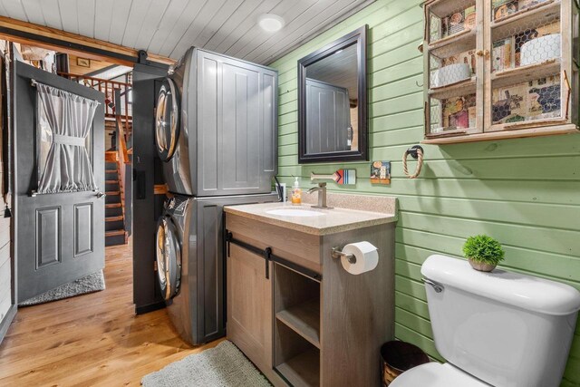 9614 Mississippi Ln, Bagley, WI 53801 - bathroom featuring vanity, toilet, wood ceiling, wooden walls, and wood finished floors