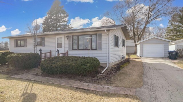 N6741 S Center Rd, Beaver Dam, WI 53916 - view of front of property featuring driveway, an outbuilding, and a garage