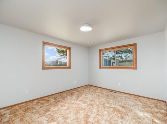 N6741 S Center Rd, Beaver Dam, WI 53916 - empty room with carpet, baseboards, and visible vents