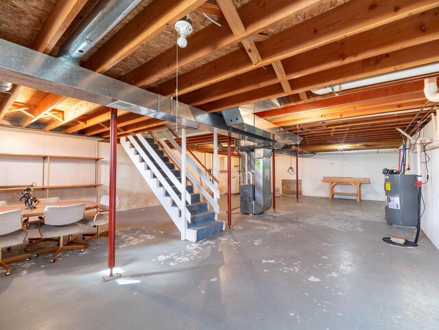 N6741 S Center Rd, Beaver Dam, WI 53916 - unfinished basement with water heater, stairs, and heating unit