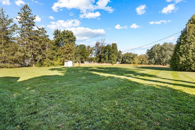 2548 Wallace Lake Rd, West Bend, WI 53090 - view of yard featuring an outbuilding and a storage shed