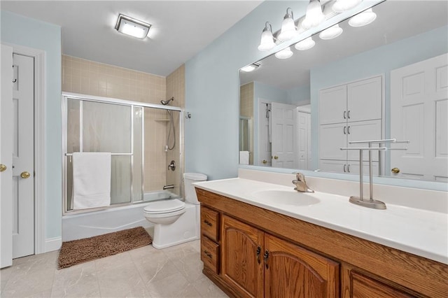 7822 Blue Valley Dr, Eau Claire, WI 54703 - bathroom with combined bath / shower with glass door, vanity, and toilet