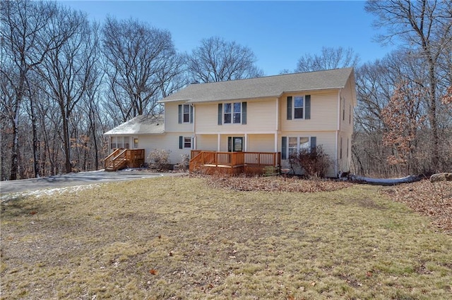 7822 Blue Valley Dr, Eau Claire, WI 54703 - rear view of house with a wooden deck and a yard
