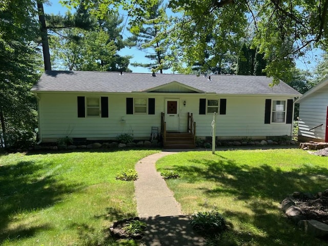 E5512 784th Ave, Menomonie, WI 54751 - ranch-style house featuring a shingled roof and a front lawn