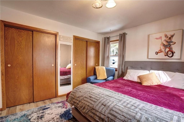 E5512 784th Ave, Menomonie, WI 54751 - bedroom with light wood-style flooring and two closets