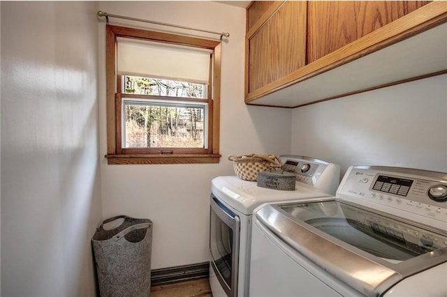 E5512 784th Ave, Menomonie, WI 54751 - clothes washing area featuring cabinet space and independent washer and dryer