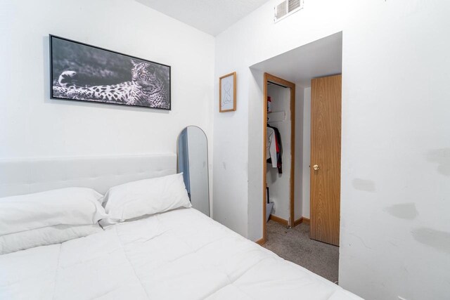 430 N 2nd Ave, Wausau, WI 54401 - carpeted bedroom featuring baseboards and visible vents