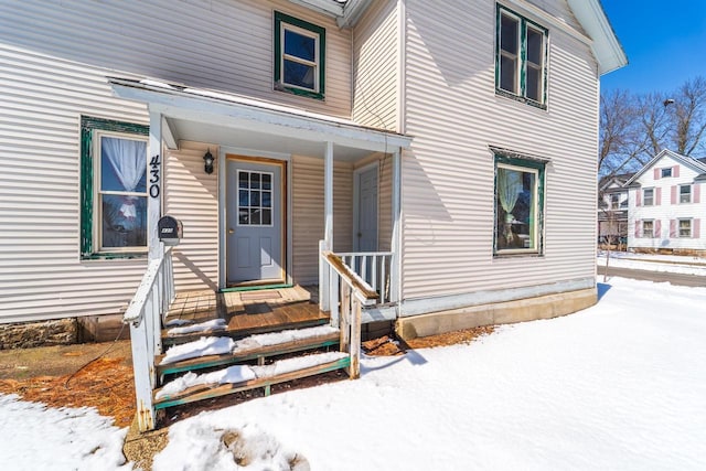 430 N 2nd Ave, Wausau, WI 54401 - snow covered property entrance featuring a porch