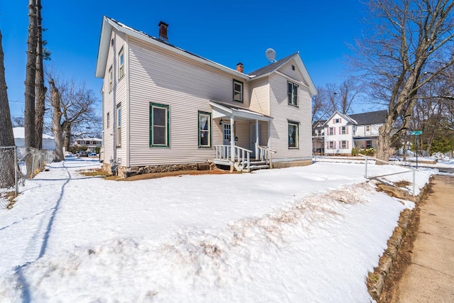 430 N 2nd Ave, Wausau, WI 54401 - snow covered house featuring fence and a chimney