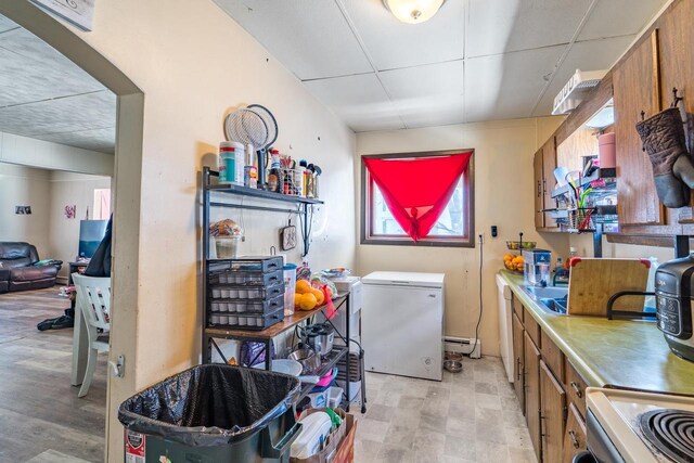 516 Hamilton St, Wausau, WI 54403 - laundry area featuring a baseboard radiator, visible vents, laundry area, and light floors