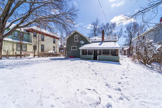 516 Hamilton St, Wausau, WI 54403 - snow covered house with a sunroom