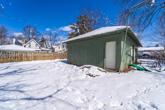 516 Hamilton St, Wausau, WI 54403 - snow covered structure with an outbuilding and fence