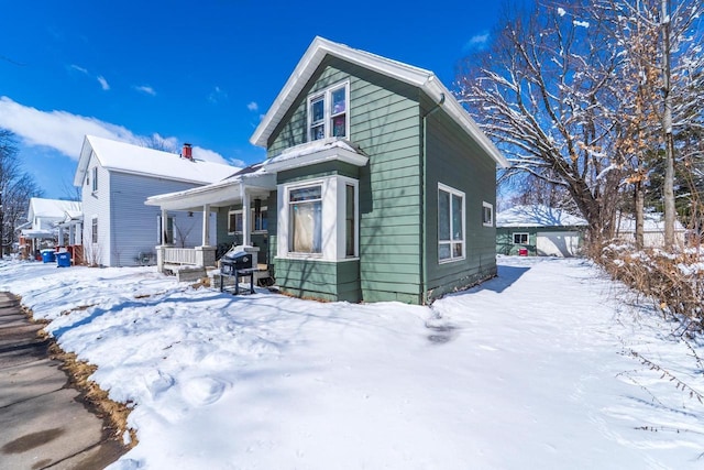 516 Hamilton St, Wausau, WI 54403 - snow covered back of property featuring covered porch