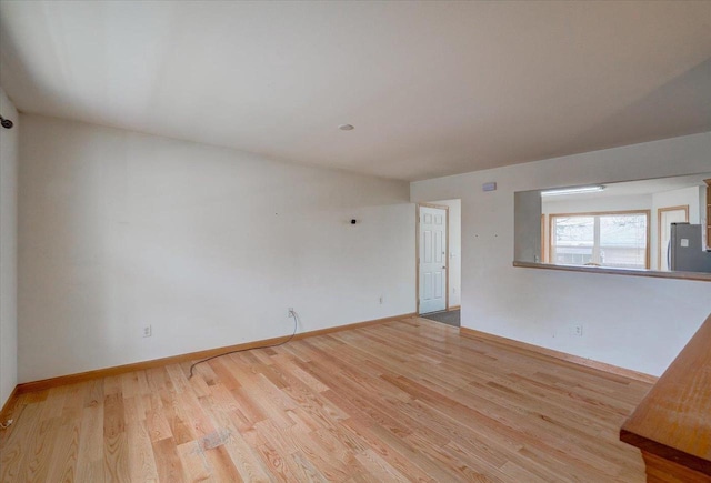 968 Pine St, Sun Prairie, WI 53590 - unfurnished room featuring baseboards and wood finished floors