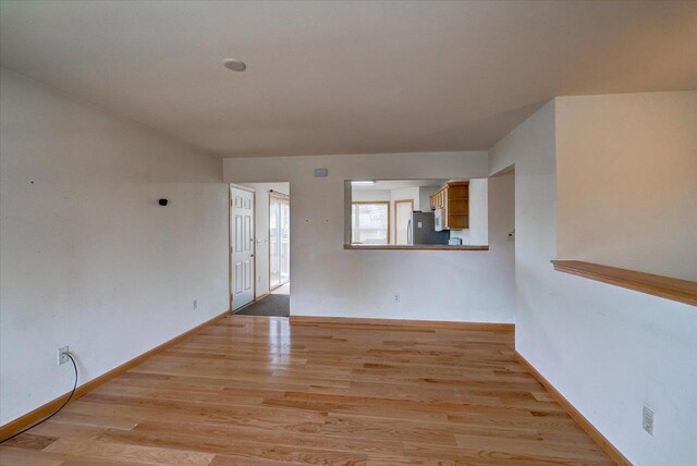 968 Pine St, Sun Prairie, WI 53590 - empty room with baseboards and light wood finished floors