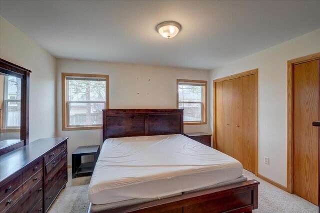 968 Pine St, Sun Prairie, WI 53590 - bedroom featuring light carpet, baseboards, and multiple windows
