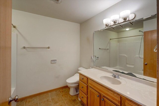 968 Pine St, Sun Prairie, WI 53590 - full bathroom with shower / washtub combination, toilet, baseboards, and vanity