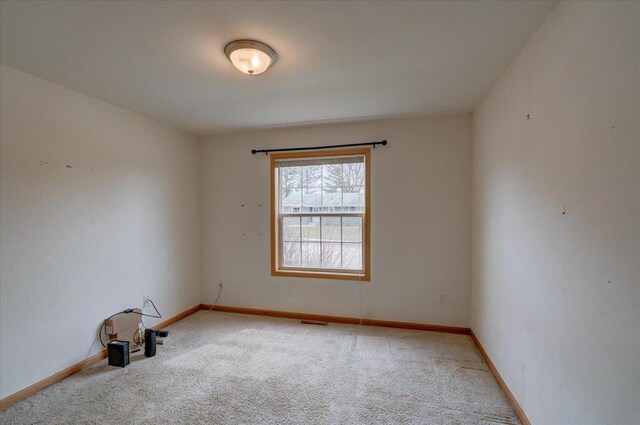 968 Pine St, Sun Prairie, WI 53590 - carpeted empty room with baseboards and visible vents
