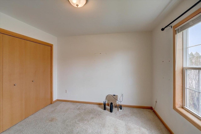 968 Pine St, Sun Prairie, WI 53590 - bedroom featuring light carpet, baseboards, and a closet