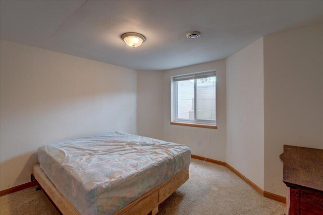 968 Pine St, Sun Prairie, WI 53590 - bedroom with baseboards and light carpet