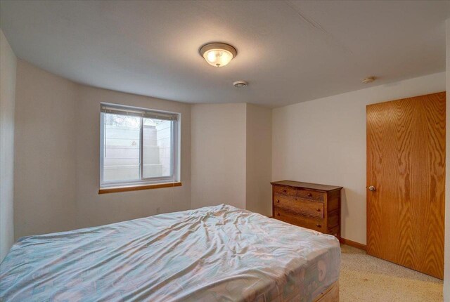 968 Pine St, Sun Prairie, WI 53590 - bedroom featuring baseboards and light colored carpet