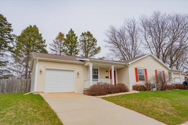968 Pine St, Sun Prairie, WI 53590 - ranch-style house featuring fence, driveway, a front yard, a porch, and a garage