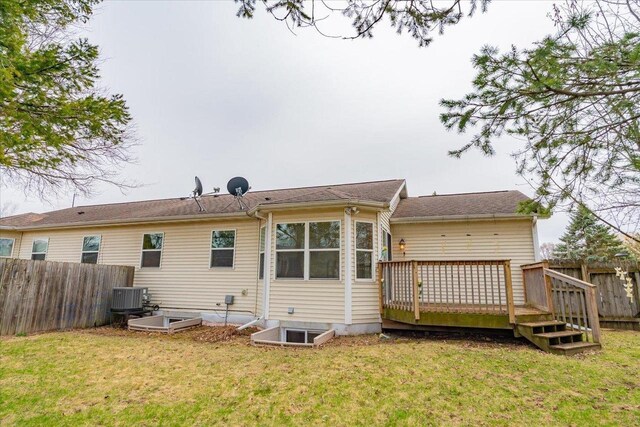 968 Pine St, Sun Prairie, WI 53590 - back of property featuring cooling unit, a yard, fence, and a wooden deck