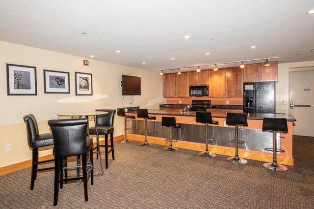 1550 E Royall Pl Unit 410, Milwaukee, WI 53202 - dining room featuring baseboards, indoor wet bar, and recessed lighting