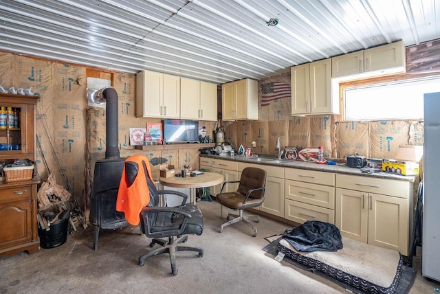 4463 E Singkofer, Superior, WI 54880 - kitchen featuring a sink, cream cabinets, and a wood stove