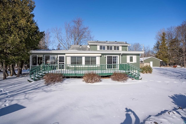 4463 E Singkofer, Superior, WI 54880 - snow covered back of property featuring a deck and an outbuilding
