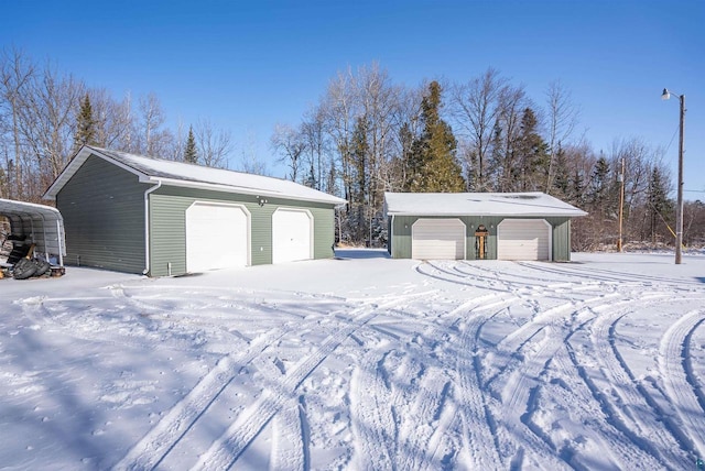 4463 E Singkofer, Superior, WI 54880 - snow covered garage with a detached garage