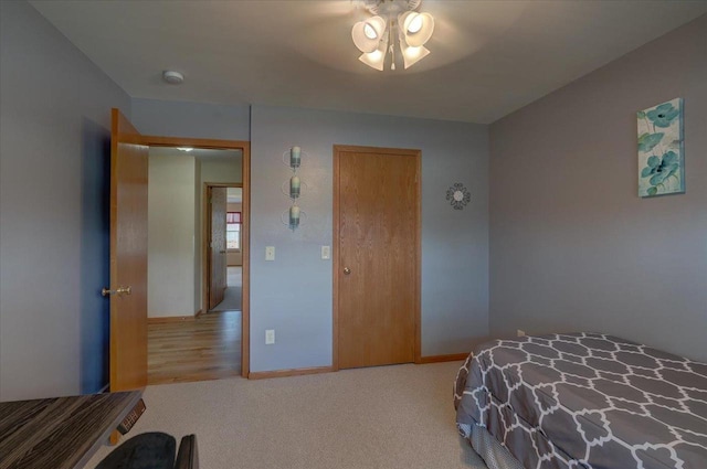 carpeted bedroom featuring baseboards