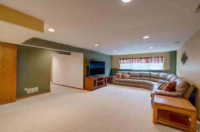 living area with carpet floors, recessed lighting, baseboards, and visible vents