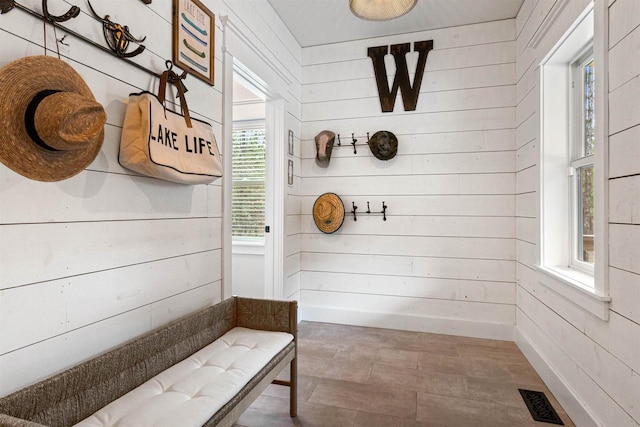 W5430 Southview Dr, Necedah, WI 54646 - mudroom with visible vents, wood finished floors, and wood walls