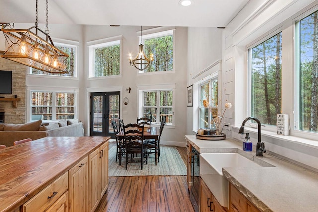 W5430 Southview Dr, Necedah, WI 54646 - interior space with an inviting chandelier, french doors, dark wood finished floors, baseboards, and recessed lighting