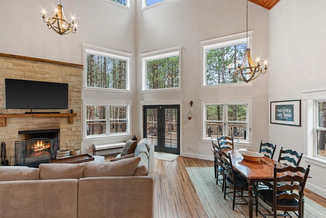 W5430 Southview Dr, Necedah, WI 54646 - living room with a towering ceiling, a chandelier, and wood-type flooring