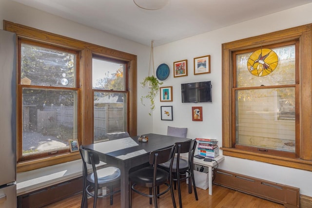 1337 Washington Ave, Oshkosh, WI 54901 - dining space with baseboard heating and wood finished floors