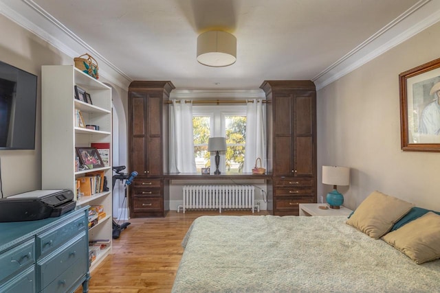 1337 Washington Ave, Oshkosh, WI 54901 - bedroom with radiator, crown molding, and light wood-style floors