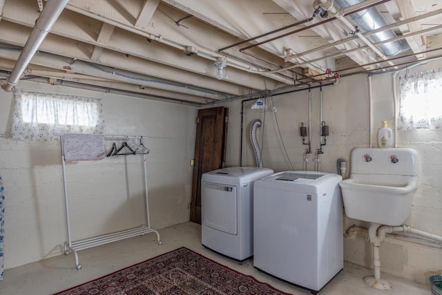 1337 Washington Ave, Oshkosh, WI 54901 - clothes washing area with a sink, washing machine and dryer, and laundry area