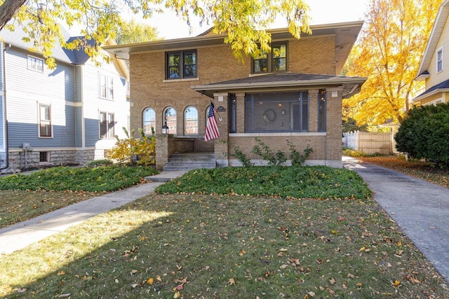 1337 Washington Ave, Oshkosh, WI 54901 - view of front facade with a front lawn and brick siding