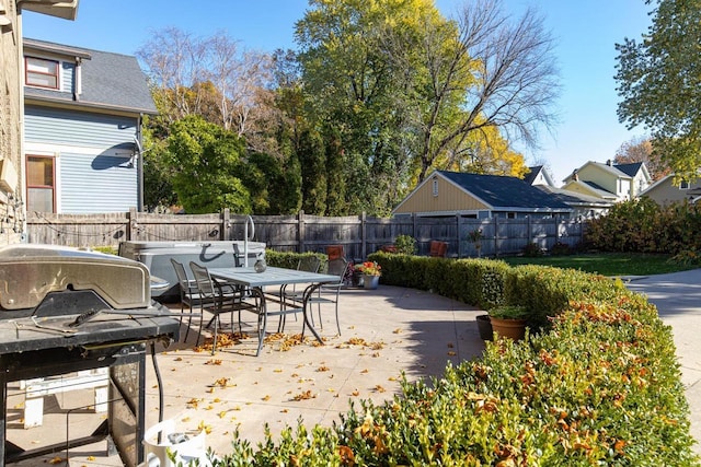 1337 Washington Ave, Oshkosh, WI 54901 - view of patio / terrace with a fenced backyard, outdoor dining space, and a grill