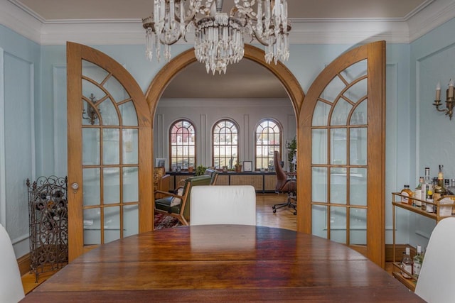 1337 Washington Ave, Oshkosh, WI 54901 - office area featuring arched walkways, french doors, a chandelier, and crown molding