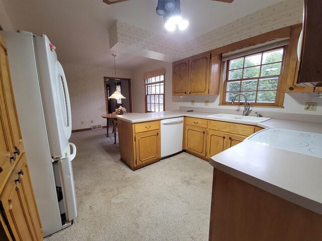 302 Riverview Ct, Portage, WI 53901 - kitchen with a sink, a peninsula, white appliances, wallpapered walls, and ceiling fan