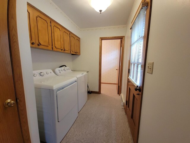 302 Riverview Ct, Portage, WI 53901 - laundry area with baseboards, cabinet space, washer and clothes dryer, and light carpet
