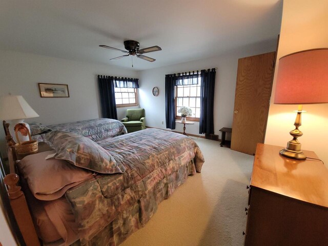 302 Riverview Ct, Portage, WI 53901 - bedroom featuring a ceiling fan and light colored carpet