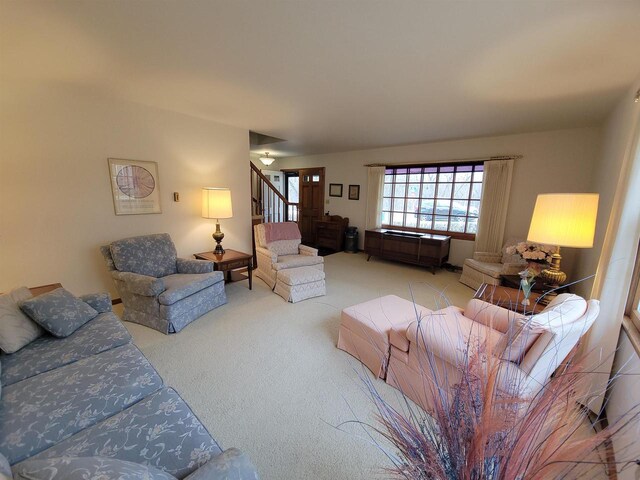 302 Riverview Ct, Portage, WI 53901 - carpeted living room featuring stairs