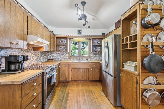 308 Forest St, Mount Horeb, WI 53572 - kitchen featuring open shelves, stainless steel appliances, under cabinet range hood, a sink, and wooden counters