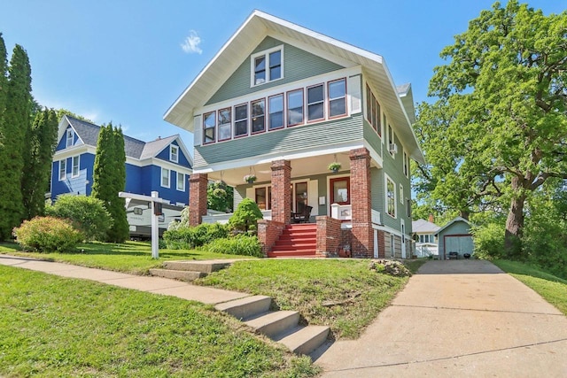 308 Forest St, Mount Horeb, WI 53572 - view of front facade with a porch, a front yard, driveway, a garage, and brick siding